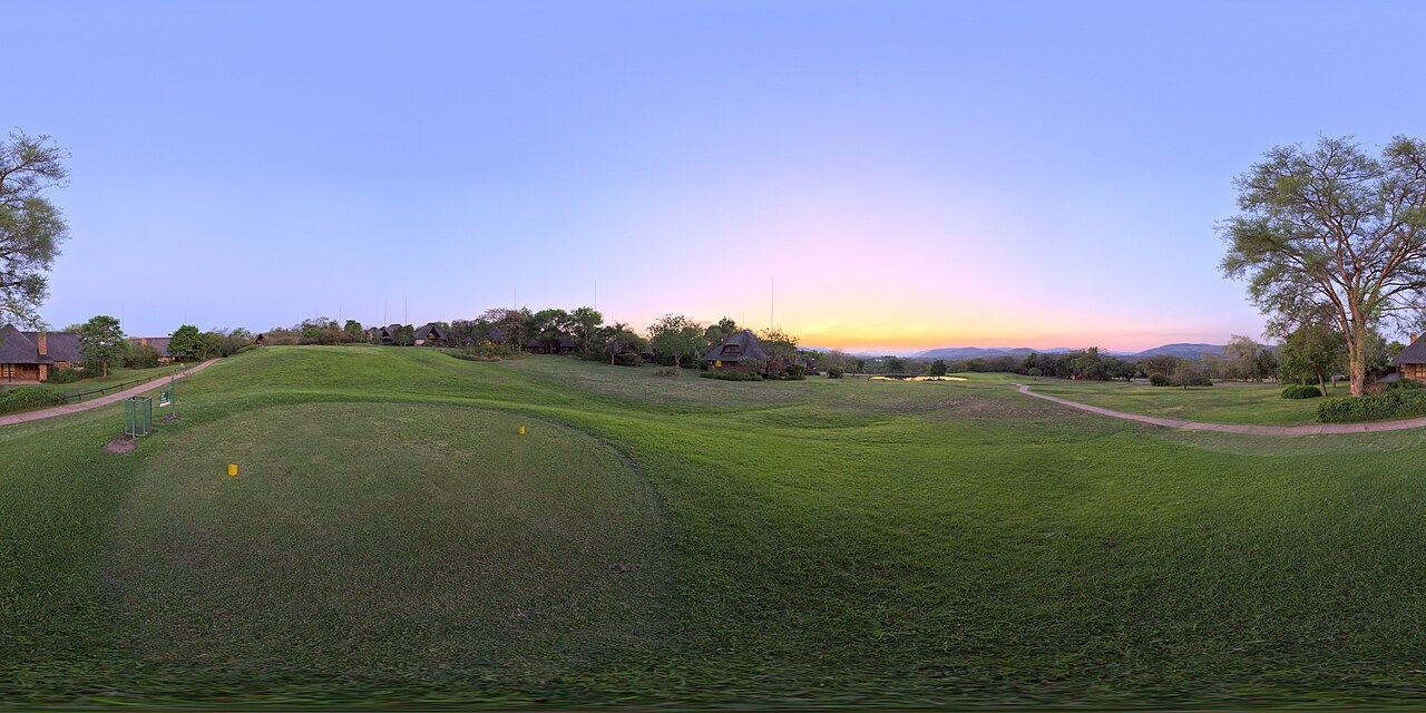 Golf course fairway at sunset