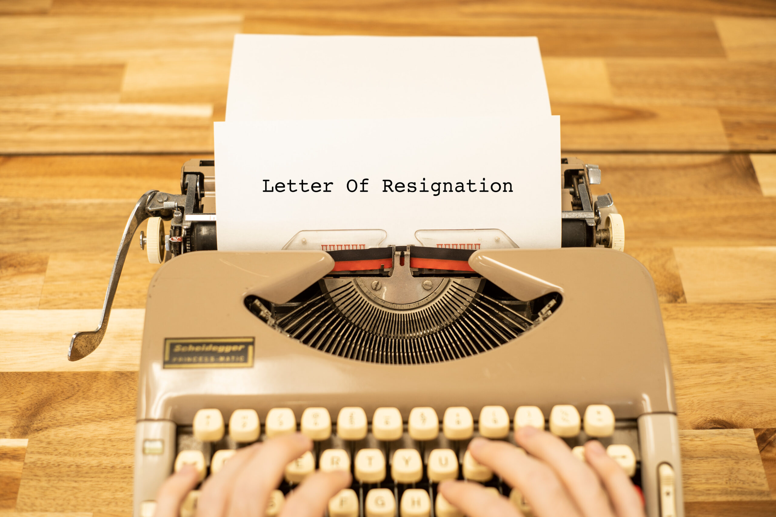 A resignation letter being typed on an old typewriter