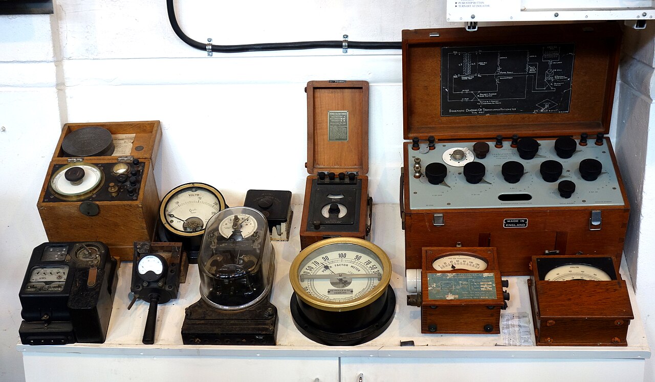 Antique electric meters and gauges on display in a museum
